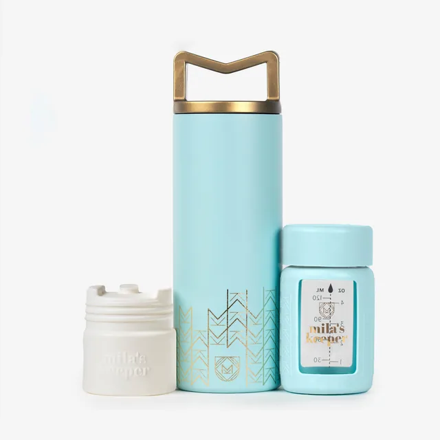 Ocean Mist Milkkeeper design - elegant aqua blue container with gold geometric accents and luxury accessories